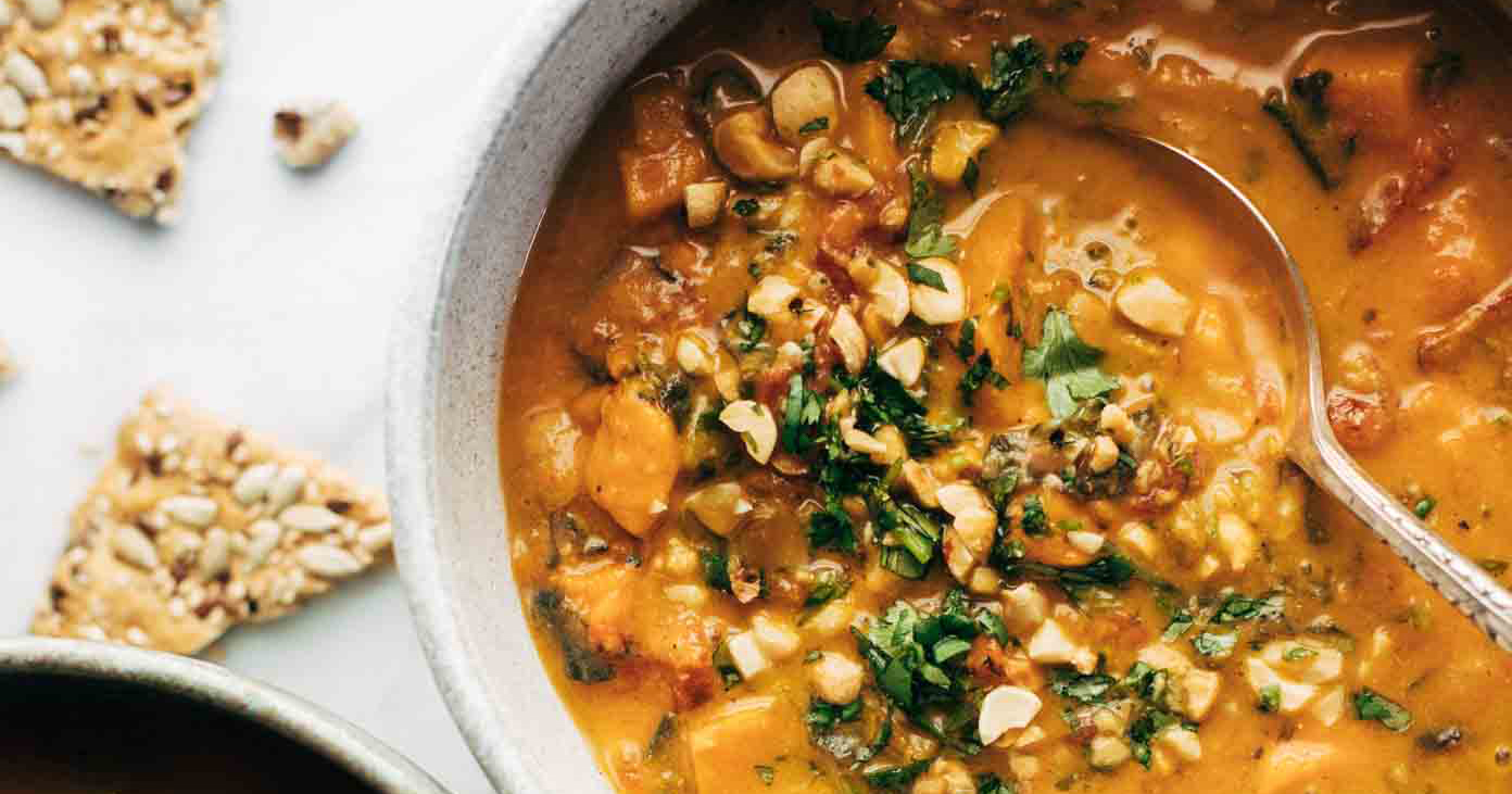 Spicy Peanut Soup with Sweet Potato + Kale